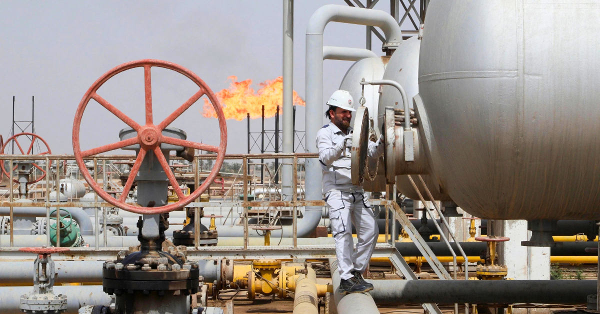 A worker inspects a tank at the Nahr Bin Umar oil field, north of Basra, Iraq, March 22, 2022. 

Image Source: Reuters 